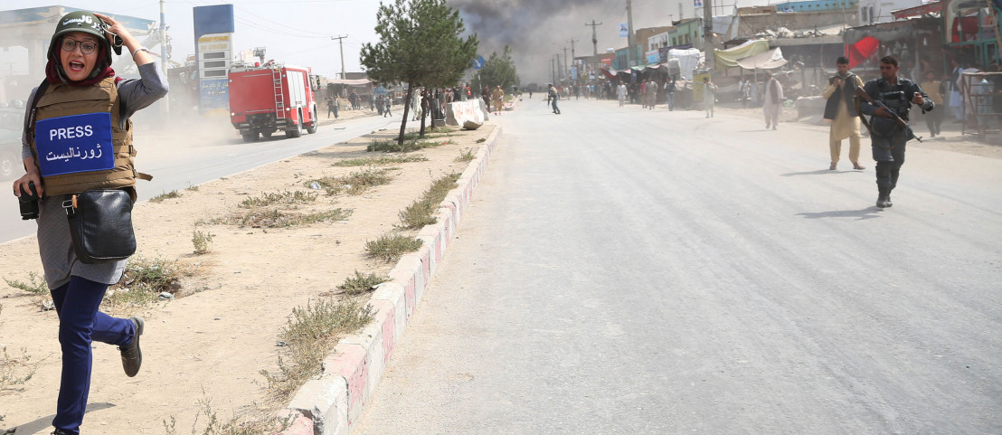 A journalist runs away from the site of a bomb attack in Kabul, capital of Afghanistan, Sept. 3, 2019. A journalist runs away from the site of a bomb attack in Kabul, capital of Afghanistan, Sept. 3, 2019.