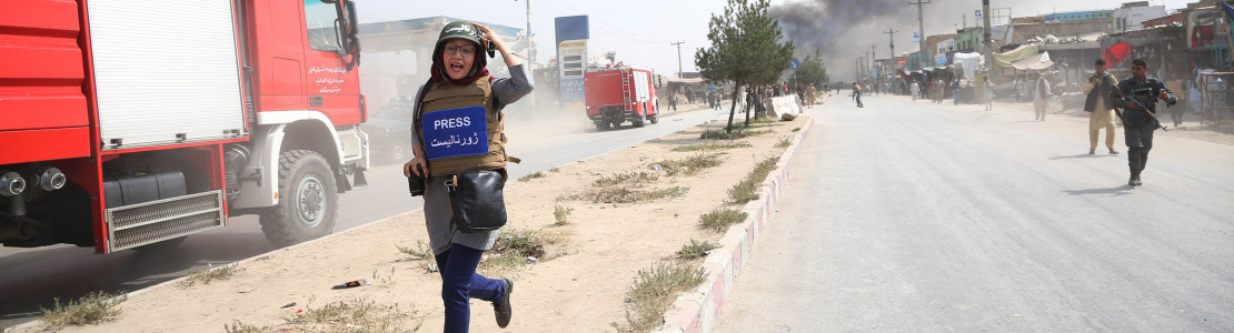 A journalist runs away from the site of a bomb attack in Kabul, capital of Afghanistan, Sept. 3, 2019.